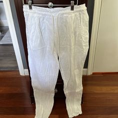 White Linen Drawstring Pants Never Worn Size Small Front Pockets White Bottoms With Drawstring And Long Pants, White Drawstring Long Pants, White Pants With Elastic Waistband And Tie-side, White Tie-side Bottom Pants For Spring, White Drawstring Bottoms For Daywear, White Drawstring Ankle-length Bottoms, Spring Pants With Drawstring And Tie-side Bottom, White Drawstring Bottoms For Spring, Spring Drawstring Pants With Tie-side Bottom