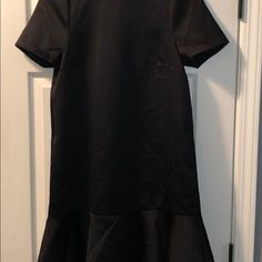 H&M Mini Black Short Sleeve Dress With Ruffle Hem And Gold Zipper On Back And Pockets. Never Worn. With Out Tags. Black Ruffled Dress, Neutral Dress, Dress With Ruffle Hem, Green Long Sleeve Dress, Blue Polka Dot Dress, Black Short Sleeve Dress, Zebra Print Dress, Snake Print Dress, Black Sweater Dress