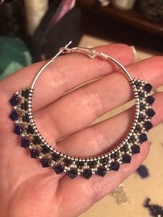 Glittering and elegant, these large hoops are sure to turn heads! Featuring lots of swar0vski crystal, glass beads, and 50mm sterling silver plated steel hoops with locking backs. Crystals are a deep cobalt blue that brightens with the surrounding light. Elegant Nickel-free Hoop Beaded Earrings, Elegant Nickel-free Beaded Hoop Earrings, Elegant Nickel Free Hoop Beaded Earrings, Nickel-free Silver Beaded Hoop Earrings, Silver Beaded Hoop Earrings In Sterling Silver, Elegant Party Hoop Earrings With Faceted Beads, Silver Sterling Beaded Hoop Earrings, Silver Beaded Sterling Silver Hoop Earrings, Silver Beaded Crystal Earrings