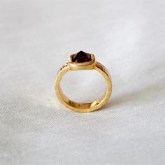 D E T A I L S - Stone: Garnet Stone Shape: PyramidMaterial: Sterling silverThe fit: True to US ring size Finish: Hammered and Gold Plated to a high shineS H I P P I N G & P R O D U C T I O N - My current production time is 2-6 business days, which means after those days are up, your order ships! I make everything custom to order, by hand, but I promise you it's worth the wait!R U S H - M Y - O R D E R -If you're in a rush to get your pretty new pieces, please send me a message and I'll let y Fine Jewelry Brown Ring As Gift, Brown Fine Jewelry Rings As Gift, Brown Gemstone Rings For Anniversary, Gold Open Ring With Accent Stones, Heirloom Crystal Ring With Accent Stones For Gift, Gold Crystal Ring With Accent Stones For Promise, Gold Crystal Promise Ring With Accent Stones, Heirloom Crystal Ring With Accent Stones As Gift, Brown Round Rings For Anniversary