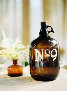 a brown glass bottle sitting on top of a table