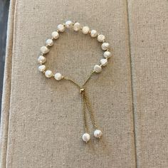 Brand New, Never Worn. Beautiful Pearl Adjustable Bracelet With Gold Chain That Adjusts By Sliding The Disc To Fit Most Wrists. Includes A Lovely Jewelry Case To Protect Your Bracelet. White Chain Bracelet With Adjustable Chain, White Round Chain Bracelet With Adjustable Chain, Adjustable Pearl Bracelet For Everyday, Everyday Adjustable Pearl Bracelet, White Adjustable Pearl Bracelet, White Beaded Bracelets With Adjustable Chain, Elegant White Beaded Bracelets With Adjustable Chain, Elegant White Beaded Bracelets With Sliding Knot, Adjustable White Beaded Bracelet