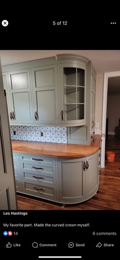 an image of a kitchen with cabinets and counter tops on the bottom half of it