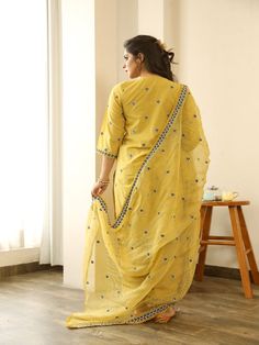 Beautiful handcrafted straight kurta pants set in pure cotton with lovely matching cotton doriya dupatta that is rightly finished with small floral embroidery motifs. Color: Yellow Fabric: Kurta & Bottom - Cotton Dupatta -Kota Doria Note: Length and sizes can be customised Length - Kurta 40 inches Pants 38 inches Available in other colors If you happen to see some deformity in hand-work or fabric, that’s mere the technique of the same and not a defect. The garment is quite premium. The product w Embroidered Cotton Silk Palazzo Set With Straight Kurta, Unstitched Chanderi Palazzo Set With Dori Work, Unstitched Kurta With Chikankari Embroidery In Slub Silk, Straight Kurta In Slub Silk With Chikankari Embroidery, Diwali Cotton Silk Palazzo Set With Chikankari Embroidery, Cotton Silk Straight Kurta With Dori Work, Cotton Silk Kurta With Dori Work, Straight Kurta In Cotton Silk With Dori Work, Traditional Mulmul Churidar With Gota Work