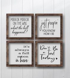 four wooden framed signs hanging on the wall with sayings in different styles and colors