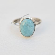 Gemstone-Larimar Shape-Oval Metal-925 Sterling Silver This One of a kind ring is adorned with beautiful Larimar Gemstone in sterling silver band. About gemstone-Larimar is known as Dolphin stone .Larimar is a crystal of serenity, clarity ,radiating healing and love energy. As a Water element stone Larimar cools hot tempers, calms fear, relieves stress and guides excessive passion into peace. It is a positive, high energy stone a good stone for clear communication and provides strength and courag Oval Amazonite Jewelry Gift, Oval Amazonite Jewelry As Gift, Oval Amazonite Jewelry For Gift, Oval Turquoise Moonstone Ring, Oval Silver Larimar Turquoise Ring, Oval Aquamarine Turquoise Ring, Oval Aquamarine Rings In Turquoise Color, Oval Aquamarine Ring In Turquoise, Elegant Oval Larimar Rings