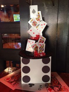 a stack of playing cards sitting on top of a table