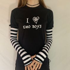 This item is hand printed on a 100% cotton t-shirt with an Acidcore label.  A Tim burton design style Black & white stripe sleeves sewn into the top with thumb holes & fingerless gives this top grunge goth vibes. The sleeves are available in the following colours: red & black, purple & black, white & black.  About Me:  Acidcore is my store based in London. All my items are hand printed with hand made transfers and some are hand embellished. My designs are inspired by different genres, gothic, fairycore, cottagecore, punk, indie. Spring Cotton T-shirt With Striped Sleeves, Emo White Tops With Letter Print, White Emo Tops With Letter Print, White Emo Style Top With Letter Print, White Emo Top With Letter Print, White Emo Crew Neck Top, White Emo Style T-shirt With Graphic Print, White Emo T-shirt With Graphic Print, White Short Sleeve Emo Tops