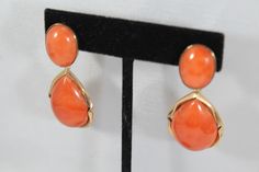 -Vintage 14k Gold Natural Japanese Momo Orange Red Coral Earring -Total length: 2 in -Round coral size: 16.5 mm x 12.4 mm -Tear drop coral size: 24.65 mm x 17.5 mm x 7.6 ( thickness ) -Total weight: 17.9 g -Tested 14k Formal Coral Jewelry With Cabochon Details, Formal Coral Jewelry With Cabochon, Elegant Coral Jewelry For Anniversary, Orange Clip-on Earrings For Formal Occasions, Formal Orange Clip-on Earrings, Formal Orange Gemstone Earrings, Luxury Coral Jewelry For Formal Occasions, Coral Jewelry Set With Matching Earrings For Formal Events, Formal Coral Jewelry With Matching Earrings