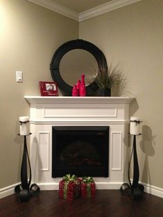 the fireplace is decorated with red and green decorations