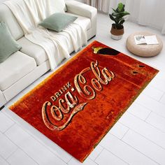 a coca cola rug in the middle of a living room