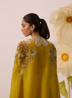 Dazzle in sunshine hues with this yellow cape lehenga set! Showcasing intricate pearl work on this beautiful palette of yellow. The blouse has extensive pearl embroidery that is based on net, the cape is on organza, and features scalloping throughout. A perfect ensemble for all your day events. Yellow Chanderi Palazzo Set With Sheer Dupatta, Yellow Palazzo Set With Sheer Dupatta For Wedding, Festive Dress With Gota Work And Cape Sleeves, Wedding Dupatta With Gota Work And Cape Sleeves, Yellow Chanderi Sets For Reception, Wedding Palazzo Set In Yellow Chanderi, Cape Sleeved Dresses With Gota Work For Weddings, Yellow Palazzo Set With Dupatta For Reception, Wedding Yellow Chanderi Palazzo Set