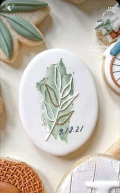 some cookies are decorated with leaves on them