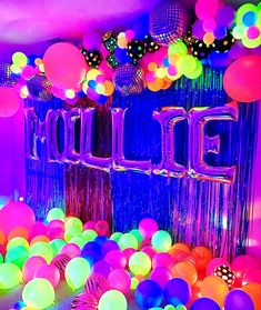 balloons and streamers fill the room with neon colors