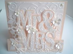 a close up of a greeting card with the word m & s and flowers on it