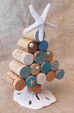 a christmas tree made out of wine corks and starfish on top of it