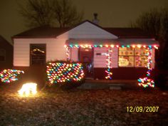 a house decorated with christmas lights and decorations