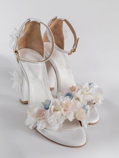 This is a pair of handmade comfortable and elegant block heels made from real leather for the upper body,straps and the inner sole. They are hand sewn and embellished with organza flowers ,real  silk cocoon flowers and real swarovski You can choose from different height for the heels such as 5,8 or 10 cm.Or different color .All shoes are custom made with your measurements on your feet for perfect fit.available sizes from 35EU-41EU A matching clutch is also available.  shipping A class registered Wedding Block Heels, Fairy Heels, Bridesmaids Heels, Flower Heels, Heels Chunky, Wedding Shoes Bride, Flower Sandals, Flower Shoes, Floral Heels