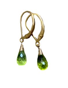 Small Green Peridot Stone drops Earrings. Peridots dangles. Natural peridot jewelry. Gold fill leverbacks. August birthday. Beautiful, soft green, natural stones in a faceted briolette shape wire wrapped to goldfill leverbacks. The earrings are 1 inch long, each stone is 8 x 6 mm. Petite earrings. Perfect for every day. Great as a gift for bridesmaids, convo for a discount. Available in 14k gold fill, Rose goldfill, sterling silver and oxidized silver. The earwire can be changed to a different o Peridot Drop Earrings For May Birthstone, Peridot Dangle Earrings With Ear Wire, Green Peridot Dangle Earrings, Peridot Dangle Earrings For May Birthstone, Green Teardrop Birthstone Earrings, Gold Teardrop Peridot Earrings, Green Briolette Earrings For Anniversary, Peridot Teardrop Earrings For May Birthstone, Teardrop Peridot Earrings For May Birthstone