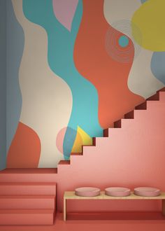 an artisticly designed staircase in front of a wall with abstract paintings on it and two bowls below