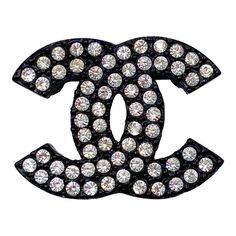 This is part of Chairish’s Costume Jewelry assortment.  Chanel Vintage Black CC Crystal Small Brooch  *Marked 02 *Made in France  -Approximately 0.9″ x 1.25″ -Great for every day wear -Very shiny and clean Luxury Black Brooches For Formal Occasions, Luxury Black Brooch For Evening, Luxury Evening Lapel Pin, Luxury Black Brooch Jewelry, Luxury Black Jewelry Brooch, Luxury Black Jewelry With Brooch, Luxury Rhinestone Brooches For Formal Occasions, Luxury Rhinestone Brooch For Formal Occasions, Broche Chanel