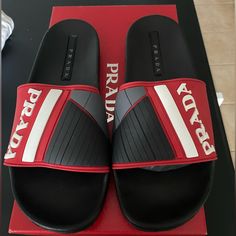 Never Worn Excellent Condition Prada Pool Slides Rubber Logo Black Excellent Condition: _brand New With Original Box _always 100% Authentic Casual Black Sandals With Red Sole, Designer Black Sandals With Red Sole, Designer Black Slides With Cushioned Footbed, Black Designer Flat Slides, Designer Black Flat Slides, Designer Black Slides With Rubber Sole, Luxury Designer Red Slides, Prada Rubber Sandals, Prada Flip Flops