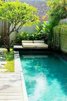 a small pool in the middle of a backyard