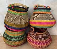 three woven baskets sitting next to each other