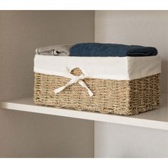 a laundry basket sitting on top of a shelf