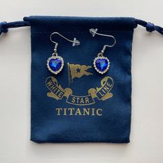 Titanic Earrings Heart Of The Ocean Jewelry With Titanic White Star Line Pouch Product Details: What You Get: Titanic Earrings And Soft Pouch Theme: Titanic Size: Refer To Pictures Perfect Gift: You Will Love It!! Kids Will Love It!! Even The Crazy Lady Down The Street Who Yells At Everyone Will Love It!! Blue Heart Earrings For Gift, Blue Earrings For Valentine's Day Gift, Blue Heart Cut Earrings For Gift, Blue Heart Cut Earrings For Gifting, Valentine's Day Gift Blue Earrings, Nickel-free Blue Heart Earrings, Blue Nickel-free Heart Earrings, Blue Nickel-free Heart Earrings As Gift, Nickel-free Blue Heart Earrings As Gift