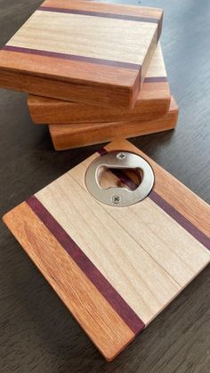 three wooden cutting boards stacked on top of each other