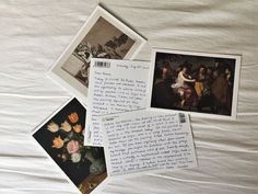 some pictures and letters on a bed with white sheets in the middle one has an image of a woman holding a flower