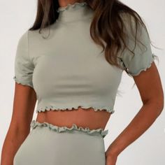 Missguided Coord Ss Crop Top Lettuce Hem ~Color Sage ~Size 8 ~Sage Jersey Short Sleeve Crop Top With A High Neck And Lettuce Hem Finish ~Regular Fit Crop - Sits At The Waist ~96% Polyester 4% Elastane *Feel Free To Request Pictures Of Actual Item *Item Is Sealed And Brand New Spring Solid Color Short Sleeve Crop Top, Spring Short Sleeve Solid Color Crop Top, Fitted Green Solid Color Crop Top, Fitted Short Sleeve Solid Color Crop Top, Green Solid Color Crop Top For Spring, Spring Green Solid Crop Top, Fitted Green Crop Top With Ruffles, Fitted Solid Color Crop Top For Spring, Stretch Crop Top With Ruffles And Short Sleeves