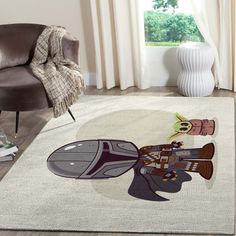 a living room with a chair and rug on the floor