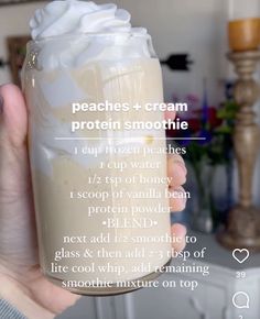 a person holding up a glass with whipped cream in it and text describing the ingredients