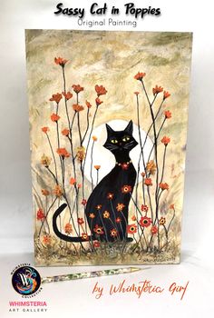 a black cat is sitting in the grass with orange flowers on it's back