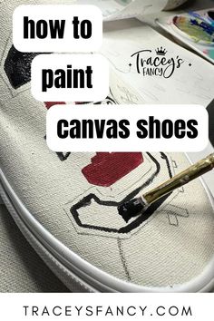 paint brush painting a school logo on white canvas shoes - Canvas Shoe Painting, Diy Fabric Shoes, Paint Canvas Shoes, How To Paint Canvas, Christmas Shoes Diy, Canvas Shoes Diy, Upcycle Shoes, Artsy Shoes, Shoe Painting