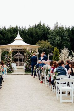 a wedding ceremony in the middle of an outdoor area