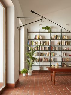 a living room filled with lots of books