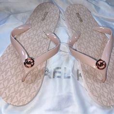 Brand New Never Worn Michael Kors Rose Gold Flip-Flops! Questions? Leave A Comment Below! Michael Kors Round Toe Synthetic Sandals, Michael Kors Gold Sandals With Round Toe, Flip Flops Michael Kors, Michael Kors Pink Open Toe Sandals, Spring Michael Kors Synthetic Sandals, Logo Flip Flops, Michael Kors Shoes, Jet Set, Pink Gold