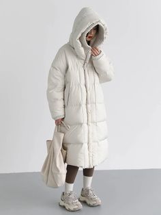 Material: 50% Polyester, 50% Nylon Step into winter with style in our Loose Hooded Long White Winter Jacket. This jacket combines the comfort of a loose fit with the elegance of a long silhouette, ensuring you stay cozy and fashionable. Embrace the season with confidence, wrapped in the warmth and versatility of this chic white winter jacket. Elevate your winter wardrobe with this timeless piece. Care: Machine Wash: Wash the jacket in cold water on a gentle cycle to preserve the fabric and color White Winter Jacket, Autumn Winter 2022, Warm Coats, Duck Down Jacket, White Duck, White Ducks, Winter 2022, Jacket Pattern, Warm Coat