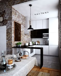 a kitchen with brick walls and an island in front of the countertop, along with white cabinets