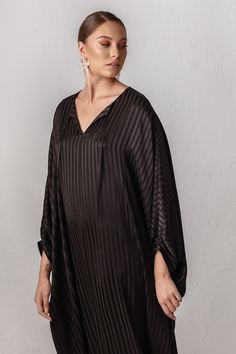 "PERFECT KAFTAN DRESS FOR WOMEN WITH WIDER HIPS! INCREDIBLY PLEASANT SUMMER SILK BLEND VISCOSE FABRIC. This black Italian Silk blend & viscose Plus Size Kaftan Dress ALYA is a perfect dress for any women's wardrobe. Whether it is a summer day at the beach walking on the promenade, a visit to the mall, an evening soiree like a cocktail party or simply a comfortable and stylish option to lounge in your home. This loose and relaxed fit long sleeves tunic ALYA has a classy yet energetic style wi Black Tunic Kaftan For Evening, Elegant Oversized Kaftan, Black Floor-length Kaftan For Summer, Summer Evening Dresses, Black Kaftan Dress, Black Silk Long Sleeve Kaftan, Black V-neck Kaftan For Evening, Black Fitted Floor-length Kaftan, Elegant Black V-neck Tunic