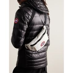 Whether you sport it around the waist or cross-body, Canada Goose's bag is a practical companion for every day. It's made from durable shell appliquéd with the label's signature logo patch and features front and back pockets for easy accessibility and reflective details that ensure visibility. Canada Goose Logo, Goose Logo, Shell Belt, Canada Goose Mens, Latest Bags, Luxury Sneakers, Bags Logo, Black Accessories, Classic Sneakers