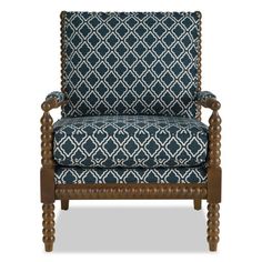 a blue and white patterned chair with wooden legs