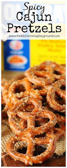 some pretzels sitting on top of a table next to a bottle of orange juice