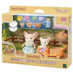 two toy animals are in a box with toys on the inside and outside, one is holding a baby stroller