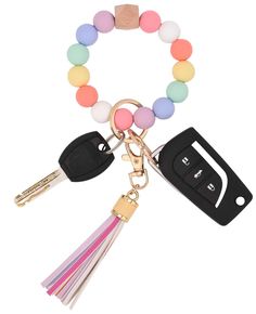 a key chain with two keys attached to it and a multicolored beaded bracelet