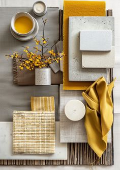 the table is set with yellow and gray decor