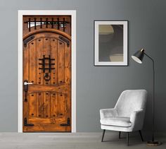 an empty chair sits in front of a wooden door